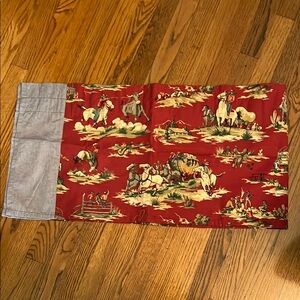 curtain valance, red cowboy print.
Maybe Wavery